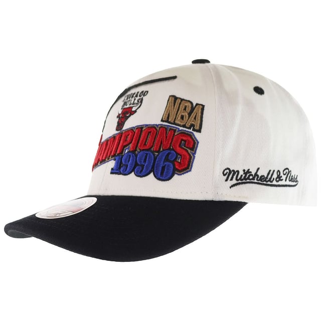The Mitchell &amp; Ness '96 Chicago Bulls Champions Wave Men's White Cap is a stylish and commemorative piece of headwear that pays homage to one of the most iconic moments in NBA history. Mitchell &amp; Ness is renowned for its high-quality sports apparel and accessories, especially its collection of retro and vintage-inspired sports gear. Here are the key features and details of this cap:

Key Features:

 Championship Celebration:  The cap celebrates the Chicago Bulls' historic championship victory in 1996, a pivotal year in the franchise's history. This design pays tribute to the Bulls' domination of the NBA during the 1995-1996 season when they secured their fourth NBA championship.

 Team Affiliation:  This cap proudly displays the Chicago Bulls team logo, making it an ideal accessory for Bulls fans and enthusiasts. The Bulls' signature red and black colors are also incorporated into the design.

 High-Quality Construction:  Mitchell &amp; Ness is known for its commitment to quality, and this cap is no exception. It is crafted from durable materials to ensure longevity and comfort.

 Adjustable Fit:  The cap typically features an adjustable strap or snapback closure, allowing you to customize the fit to your head size and preferences.

 Structured Crown:  The cap's structured crown maintains its shape, giving it a classic and timeless look that's suitable for various occasions.

 Curved Brim:  The cap's curved brim not only adds to its style but also provides shade and protection from the sun.

 Officially Licensed:  Mitchell &amp; Ness is an officially licensed NBA merchandise manufacturer, so you can trust that you're getting an authentic product.

 Collectible Item:  Caps that commemorate specific championship victories and historic moments often become collectible items for sports fans and cap enthusiasts.

 Versatile Styling:  Whether you're wearing it to a Bulls game, during outdoor activities, or as a fashion statement, this cap can be incorporated into various outfits and styles.

 Gender-Neutral:  While it's labeled as a men's cap, caps like these are often considered gender-neutral, and anyone can wear them to show their team pride.

In summary, the Mitchell &amp; Ness '96 Chicago Bulls Champions Wave Men's White Cap is a stylish and commemorative accessory that celebrates the Chicago Bulls' historic championship victory in 1996. Its high-quality construction, adjustable fit, and officially licensed design make it a must-have for Bulls fans and collectors of sports memorabilia. Whether you're wearing it to the game or as a fashion statement, this cap allows you to showcase your Bulls pride with style while remembering a significant moment in NBA history.