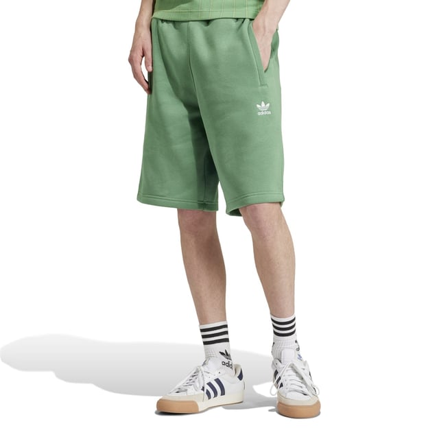 Mens adidas Originals Trefoil Essentials Shorts in preloved green.Going beyond basic  these adidas shorts are built for everyday comfort. The cotton-fleece blend is easy to wear  and zippered pockets stash the essentials so you can keep living life on the go. The versatile design is ready to pair with anything from a tee to a sweatshirt. However you wear them  these shorts will become the pair you reach for time and again.- Simple shorts destined to become a favourite top-drawer choice.- Regular fit- Drawcord on elastic waist- 70% cotton  30% polyester (recycled)- Side zip pockets- Ref: IU2355