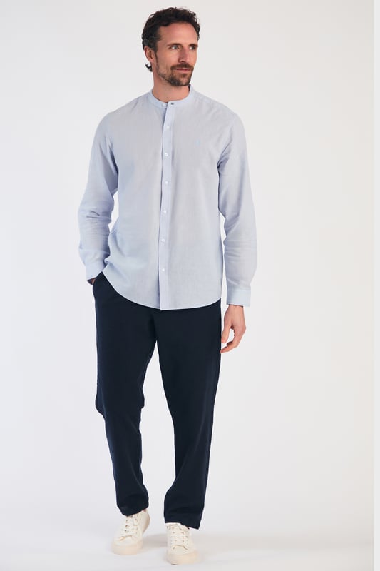Blue Linen Blend Long Sleeve Button-Up Shirt With Grandad Collar Upgrade your wardrobe with this long-sleeved linen shirt from Nines by Kensington Eastside. Made from a breathable blend of linen and cotton, this shirt features a grandad collar and button fastening. Perfect for casual and formal occasions, this machine-washable shirt is a versatile addition to any wardrobe.