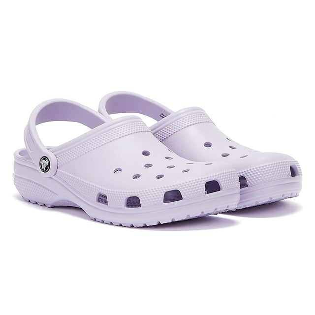 Womens Crocs Classic Clogs in lavender.- Slip on fastening.- Pivoting heel straps.- Ventilation ports add breathability and help water and debris drain away.- Croslite™ footbed.- Lightweight  non-marking soles.- Ref: 10001530L