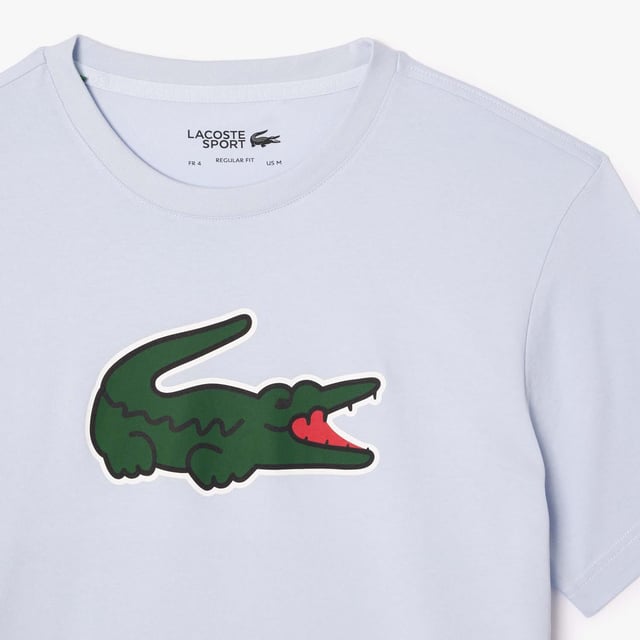 Men's Lacoste Sport Ultra-Dry Croc Print T-shirt.- Technical jersey.- Regular fit, straight cut.- Crew neck.- Print on front.- Silicone crocodile on front. Material: 65% Cotton, 35% Polyester. Ref: TH7513IL4.