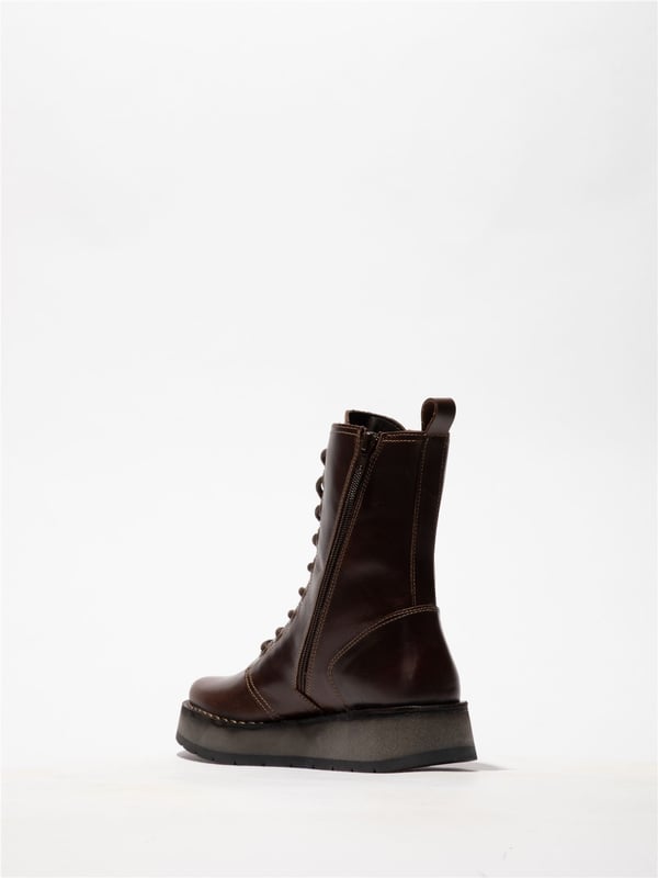 The Fly London RAMI043FLY Casual Lace-Up Ankle Boots offer a stylish yet practical addition to your footwear collection. Crafted from high-quality leather with a soft microfiber lining, these boots provide all-day comfort and abrasion-free wear. The classic lacing system is paired with a convenient side zip for easy on/off. Featuring a foam-padded, microfiber-lined footbed and a durable rubber wedge sole. These boots ensure cushioning, grip, and traction, Perfect for everyday use, Premium leather upper with soft microfiber lining, Lace-up with side zip for easy wear Cushioned, Foam-padded footbed, Durable rubber wedge sole for grip, Flat heel for all-day comfort.