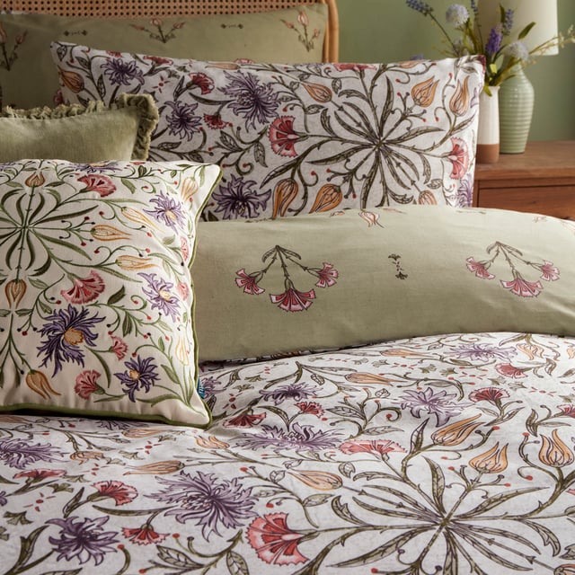 Transform your bedroom into a serene oasis with the Tilda Floral Duvet Cover Set. Infused with the elegance of floral paintings on ceramics, its captivating tile pattern in calming hues evokes a sense of nature's tranquility. The reverse side, adorned in soft sage green florals, offers a harmonious retreat. Crafted from cotton-rich fabric with a 180 thread count, it promises both comfort and style. Ideal for those who cherish the interplay of print and nature, this set gracefully marries boho charm with modern sophistication, making every night a restful escape into beauty. 230 x 220cm