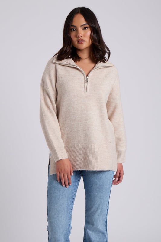 Model is 5'6 and wears a size 8. Crafted with utmost attention to detail, the Oatmeal Plain Oversized Half Zip boasts a relaxed and flattering oversized fit that drapes elegantly, providing a cosy and stylish look for any occasion. Its soothing creates a sense of sophistication, making it a timeless piece that can effortlessly transition from season to season.