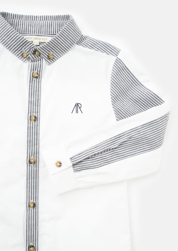 Our   shirt re-mix! Cut and sew colourblock mixing clean   poplin with a classic ticking stripe. Smart dressing! About me: 100% Cotton Angel and Rocket cares: I'm made from Sustainable Cotton Look After Me: Think Planet. Wash At 30C.