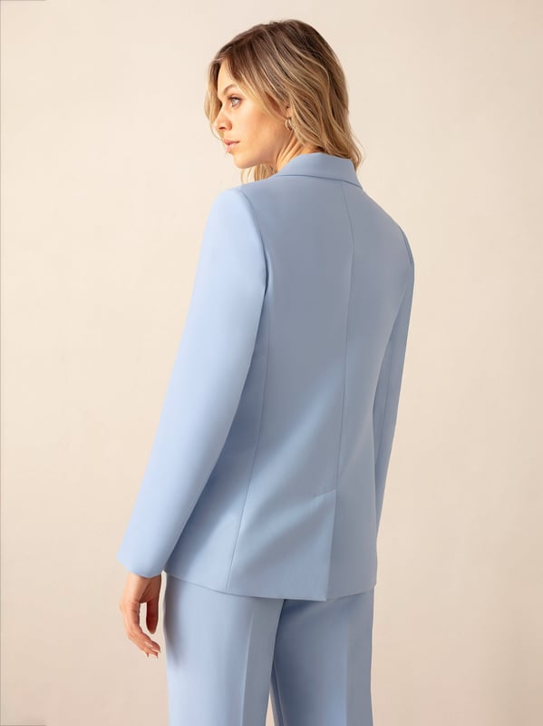 Co-founders' Notes

Introducing our Blue Double-Breasted Blazer, expertly crafted from a viscose blend premium crepe for a luxurious feel. This fully lined blazer showcases a trending blue tone, offering a sophisticated touch to your wardrobe. For a polished ensemble, pair it with matching trousers and a bandeau top, creating a stylish and cohesive look that transitions seamlessly from day to night.

Fully lined

Classic fit
Double breasted design
Classic, standard fit. Try your usual size



Fabric &amp; Care



Composition: Main: 74% Polyester 19% Viscose 7% Elastane Lining: 100% Polyester


Garment Care: Dry Clean Only



Size &amp; Fit


Classic, standard fit. Try your usual size

Length: 74cm (size 10)

Model is 170 cm/5'7" and is wearing a size 10