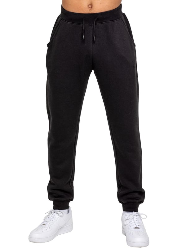 <p>Experimenta la máxima comodidad y estilo con los Joggers de Corte Regular para Hombre de Kruze, diseñados para mantenerte acogedor y luciendo elegante. Hechos con felpa interior cepillada, estos joggers ofrecen una suavidad y calidez excepcionales, convirtiéndose en una opción ideal para relajarte o salidas casuales. Con una cinturilla acanalada y cordones ajustables, brindan un ajuste seguro y personalizado, mientras que los puños ribeteados añaden un aspecto moderno y ajustado que se sitúa de manera ordenada sobre tus zapatillas. Los joggers incluyen dos bolsillos laterales convenientes, perfectos para mantener los esenciales al alcance, y un logo impreso en goma de Kruze en la pierna izquierda que añade un toque de marca distintiva.</p>