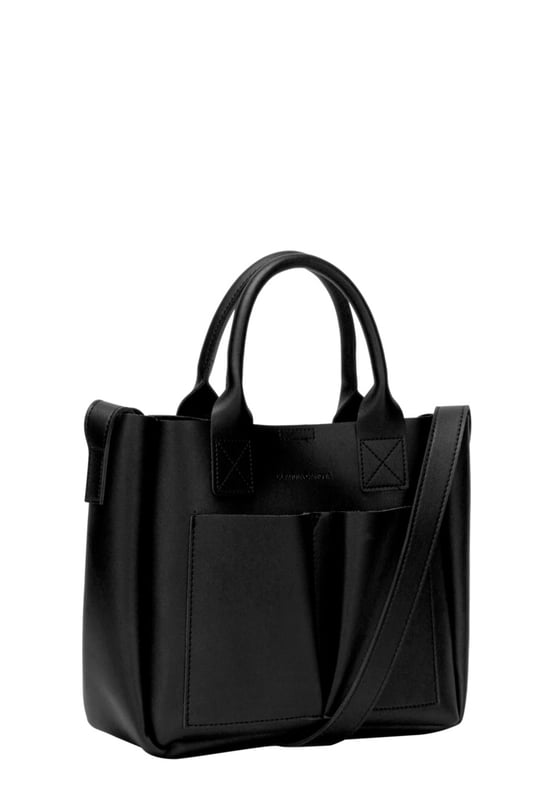 This dreamy mini grab bag is perfect for adding a contemporary look to your outfit. The soft PU exterior and contrast unlined interior gives it a premium finish and the gunmetal hardware adds quality. The subtle Claudia Canova blind debossed logo and intricate stitch detail finishes the look. Inside is a secure zip top pouch, which can be removed by unfastening the snap clasp buttons, perfect to use as a portable makeup bag or to keep valuable items more secure. Features: , soft pu outer, Unlined Interior, Claudia and Canova Blind Deboss Logo, 2 x Short Grab / Tote Handles, Adjustable longer shoulder strap, Magnetic snap claps opening to the main compartment, Removable zip top pouch (Meausure 215W x 152H x 50D), 2 x Quick access slip pockets in front Style Ref: 84608 BLACK