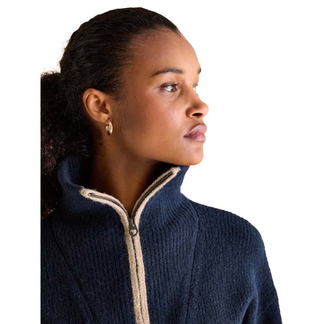 Elevate your knitwear this season with the Elmore navy jumper. Its quarter zip fastening and dropped shoulders gives it an effortless 'throw on' feel, that will keep you comfortable and stylish. The oversized ribbed collar adds interest and features contrasting colour tipping. It's finished with a ribbed hem and cuffs. Style over a slim-fitting top for a layered-up look and your favourite pair of jeans.