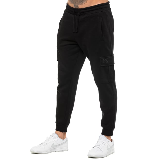 Enzo Mens Regular Fit Cargo Joggers. Features 2 Side Slash Pockets, 2 Cargo Pockets, Single Welt Back Pocket. Brushed Back Inner Fleece. Elasticated Waistband With Adjustable Drawstring. Cuffed Ankle. Features EZ Logo.