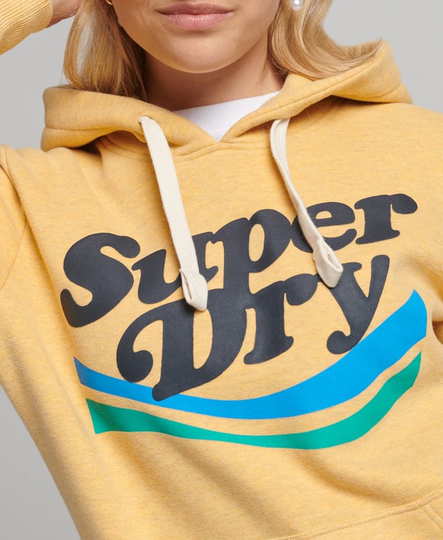 Superdry Vintage Cooper Nostalgia Hoodie Our Vintage Cooper Nostalgia Hoodie brings a playful nature to your wardrobe. Retro-inspired graphics pay a loving homage to iconic designs, and effortlessly turn your casual out into a statement. With brushed lining and ribbed trims, these hoodies embody that trusted Superdry quality and are sure to keep you cosy.Relaxed fit – the classic Superdry fit. Not too slim, not too loose, just right. Go for your normal sizeDrawstring hoodLarge front pocketRibbed cuffs and hemBrushed liningSuperdry patch