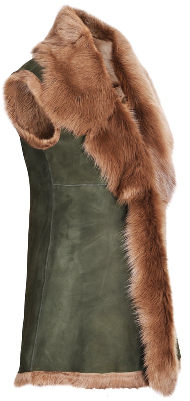 A high-quality garment that is perfect for maintaining an elegant look whilst keeping warm during the colder months. This gilet is extended in length and features our premium Spanish Toscana sheepskin, which is renowned for being amongst the warmest and most comfortable wools in the world. The soft woollen lining can either be concealed with a hook and eye fastening or exposed at the front opening in a distinctive waterfall design for an extravagant look, making it the perfect piece for adding a touch of elegance to your winter outfits. • Exclusively manufactured in the UK using double faced Toscana sheepskin • Toscana sheepskin lining is unparalleled in providing warmth and comfort • Exterior and interior painstakingly crafted for a soft silky finish • Length of 30”
