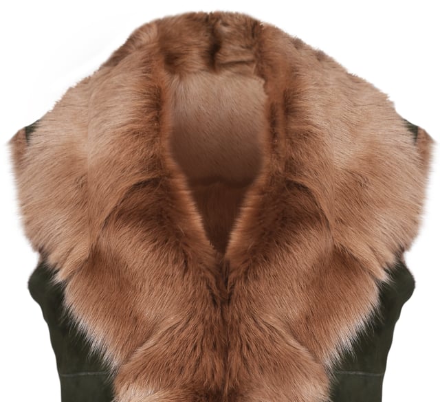 A high-quality garment that is perfect for maintaining an elegant look whilst keeping warm during the colder months. This gilet is extended in length and features our premium Spanish Toscana sheepskin, which is renowned for being amongst the warmest and most comfortable wools in the world. The soft woollen lining can either be concealed with a hook and eye fastening or exposed at the front opening in a distinctive waterfall design for an extravagant look, making it the perfect piece for adding a touch of elegance to your winter outfits. • Exclusively manufactured in the UK using double faced Toscana sheepskin • Toscana sheepskin lining is unparalleled in providing warmth and comfort • Exterior and interior painstakingly crafted for a soft silky finish • Length of 30”