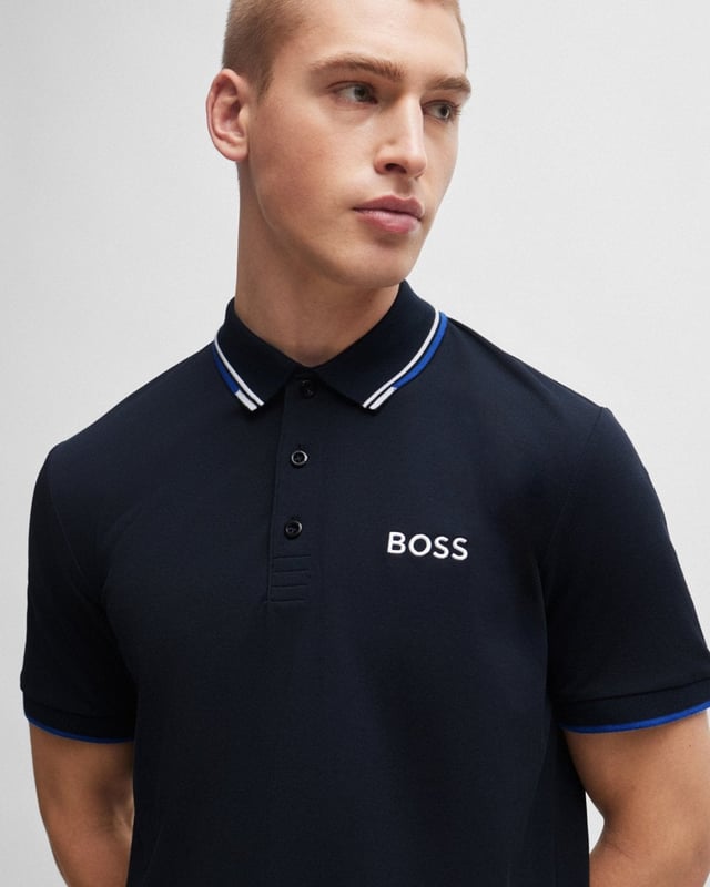 A distinctive polo shirt cut to a regular fit, by BOSS Menswear. Featuring contrast branding at the left chest and back neck, this short-sleeved polo shirt is designed in cotton-blend fabric with S.Café® and stretch for casual comfort. 3D stripes add a sporty touch at the collar and cuffs.
Regular fitFlat-knit collarNumber of buttons: 3Short sleevesFlat-knit cuffsStandard length
56% Cotton, 39% Polyester (recycled) , 5% Elastane
50469102
 