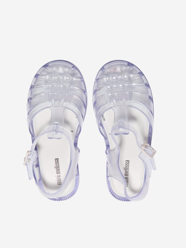 Get them summer ready with these sandals from Mini Melissa. Features a logo embossed at outer side, pin-buckle fastening and velcro strap at ankle for easy wear and a foam rubber footbed for a comfortable fit.