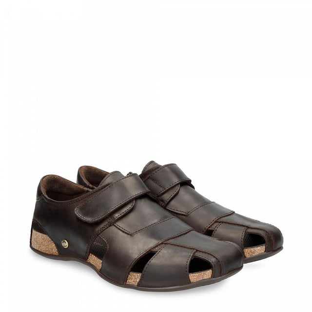 Step into comfort and style with our Panama Jack Men's Leather Sandals, the Fletcher Basic. Crafted for the adventurous soul, these half-open shoes offer a perfect blend of functionality and fashion. Experience unmatched comfort and durability with the Velcro Closure and natural greased nappa leather construction. Enjoy a luxurious feel with leather lining and anatomical insole, providing support and cushioning for all-day wear. Navigate any terrain with confidence, thanks to the flexible and durable TR rubber sole, ensuring stability and grip on outdoor adventures. Bullet Points: Velcro Closure for easy and adjustable fitNatural greased nappa leather construction for durability and styleLeather lining for luxurious comfortAnatomical insole for added supportFlexible and durable TR rubber sole for stability on various surfaces