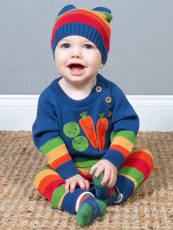 Colourful and cute! Perfect for playing or snoozing, this beautiful veggie knit romper is comfy, practical and great for the season. Featuring Kite's vibrant rainbow stripe and gorgeous veggie appliqué design.