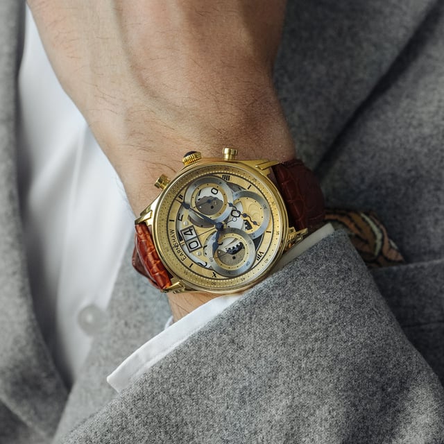 Collection: Nasmyth Grande Date Chronograph Japan Quartz Big Date
Model: Es-8260-04
Movement: Japan Quartz 
Case Material: Stainless Steel
Case Diameter (mm): 43
Case Thickness (mm): 15
Case Shape: Round
Case Color: Gold
Dial Color: Gold
Band: Genuine Leather Strap
Band Color: Tan
Buckle: Strap Buckle
Band Width (mm): 22
Water Resistance: 5 Atm
Watch Weight (g): 130
Warranty: 2 Years International Warranty