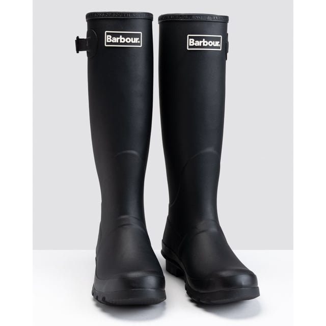 Bede Ladies Wellington Boots The Barbour Bede Wellington Boots are constructed with the classic rubber outer, chunky non-slip sole and a cotton twill inner that's both lightweight and durable. Finished with a rubber Barbour badge to the top of the leg.
100% Rubber outer
100% Cotton twill inner
Barbour branded rubber patch