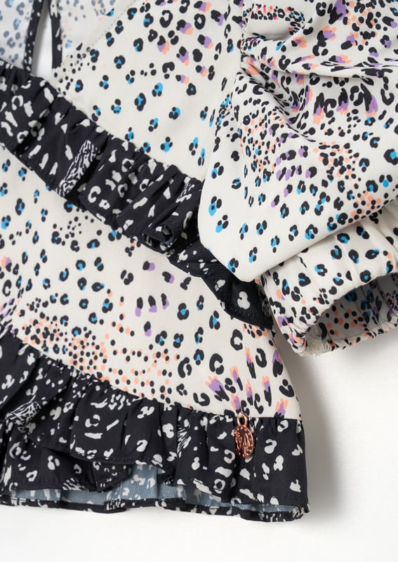 Statement sleeve - tick. Animal print - tick. Playful ruffles - tick. This top has it all. Wear with our Estelle trouser for the ultimate co-ord!.
