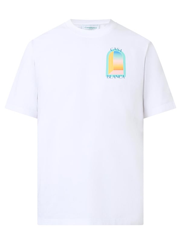 The T-shirt features a classic cut with a round neckline, offering a timeless silhouette. The front is graced with a vibrant, stylised print depicting an abstract representation of a window or gateway, bathed in the soft pastel hues of blue, yellow, and orange, evoking the serene beauty of a sunset. 