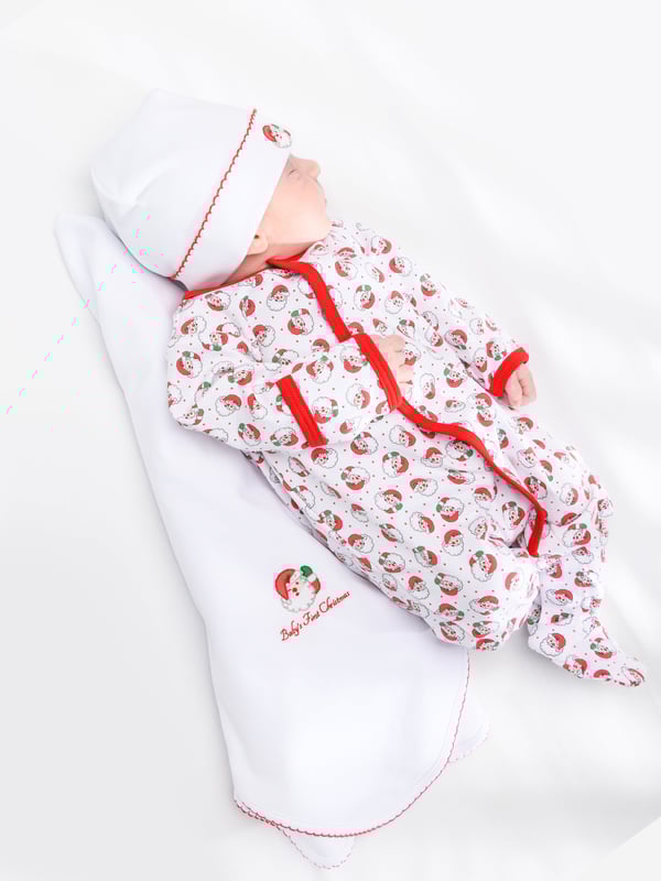 Introducing the Baby Winking Santa Receiving Blanket in White by Magnolia Baby - an essential piece for your Baby Unisex nursery. This blanket merges luxury and comfort, ensuring your baby feels wrapped in love.  Enchanting Design: Featuring an irresistibly cute winking Santa print, this blanket will become a charming focal point in your baby's nursery. Relaxed Comfort: Crafted from plush, high-quality fabrics, this blanket promises to provide unparalleled coziness that your baby will love.  Elevate your Baby Unisex nursery with the Baby Winking Santa Receiving Blanket in White from Magnolia Baby. Purchase now to let your little one bask in premium comfort and style!