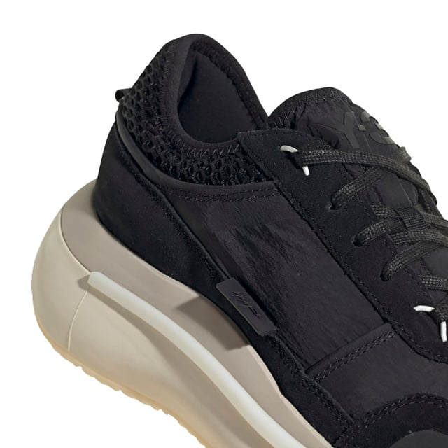 Mens Y-3 Ajatu Run Trainers in black cream.- Suede  double-layer textile and mesh upper.- Lace closure.- Lightstrike cushioning.- Collapsible feel.- Suede and mesh lining.- Rubber outsole.- Ref: GW8613