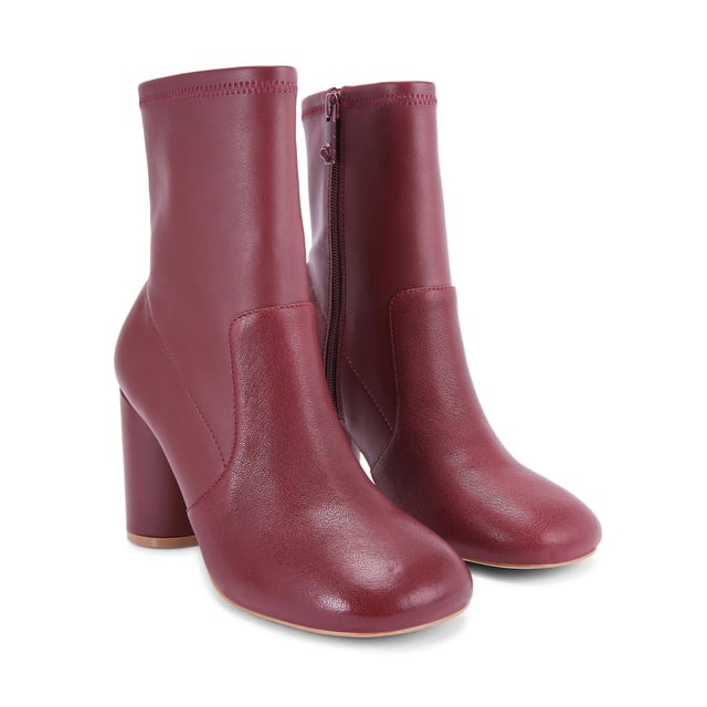This Langley Round Ankle Boot features a wine upper crafted from a soft leather. The heel is rounded matching the toe shape. Heel height: 9cm.