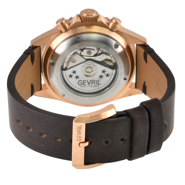 A distinctive, Swiss-made timepiece is always a sound investment. Artfully reminiscent of the famed New York City skyline, each watch in the Gevril Wall Street Swiss Automatic Chronograph Watch Collection commands attention with a stainless steel, architectural design.

The unidirectional rotating bezel frames sapphire-doomed, impressively highlights the chronograph sub dials at 3:00, 6:00 and 9:00 o’clock
anti-glare crystal. Detailed to perfection, a magnified lens showcases luminous indices and hands on a contrasting dial. Embrace the natural oxidation process as a testament to the enduring quality of bronze, symbolizing its ability to withstand the test of time while acquiring a captivating allure.  Form never suffers to function: each watch is water resistant for up to 100 meters and features a stainless-steel bracelet with folding deployment closure or a Genuine Italian Handmade Leather Strap.
The Wall Street Collection makes a strong statement.


Gevril 4166 Men’s Wall Street Bronze Chronograph Swiss Automatic Watch

Gevril Mens Swiss Automatic Watch from the Wall Street Bronze Chronograph Collection
44mm Bronze Brushed Case, Green Ceramic Ring, Green Lacca dial, gold satin index
Embrace the natural oxidation process as a testament to the enduring quality of bronze, symbolizing its ability to withstand the test of time while acquiring a captivating allure.
Unidirectional rotating bezel, Bronze Crown with logo, Exhibition screw down case back
3 Chrono Sub dials, Date at 3 o'clock
Genuine Handmade Italian Brown Leather Strap with Bronze Brushed Buckle
Anti-reflective Sapphire Crystal
Water Resistant to 100 Meters/10ATM
Swiss Made Automatic Chronograph Movement ETA 7750
