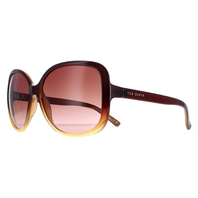 Las gafas de sol Ted Baker TB1312 Krash 142 negro marrón son un accesorio elegante y con estilo que elevará cualquier look. Estas gafas de sol tienen un diseño de mariposa que les da un aspecto moderno y sofisticado. Perfectas tanto para ocasiones informales como formales, estas gafas de sol son toda una declaración de estilo. El logotipo de Ted Baker aparece en las finas patillas para garantizar la autenticidad de la marca.