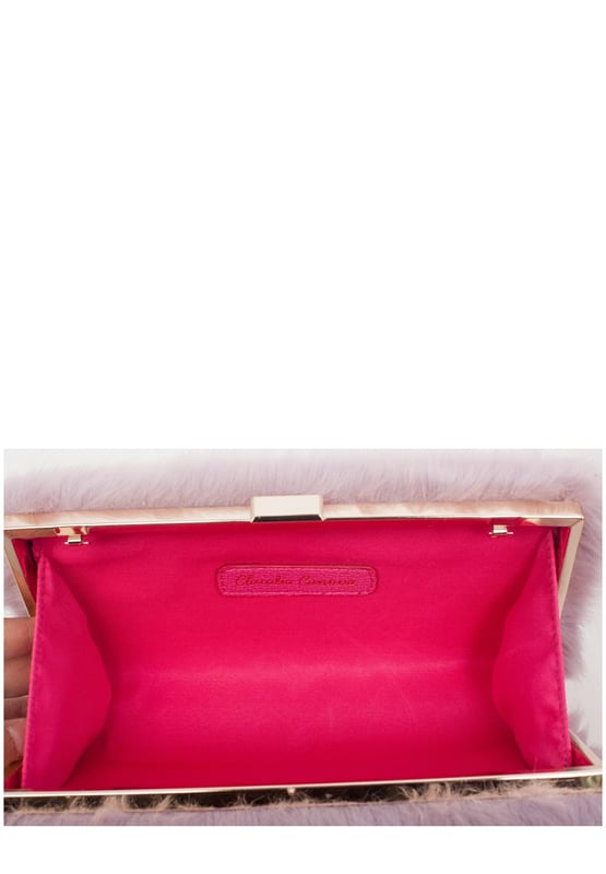 A girls wardrobe is never too full of fabulous bags! Set the trend this season with this funky and tactile faux fur Pandora clutch bag- the must have statement look. Inside is lined with fuchsia twill lining and the handy slip pocket- perfs for your party night essentials! It comes with a fierce detachable gold chain shoulder strap so you can switch up the style to suit whatever outfit you are slayin. Features: , Tactile faux fur exterior, Metal frame and clasp, Detachable chain shoulder strap, Fuschia twill lining, Inner slip pocket Style Ref: 81853 LILAC