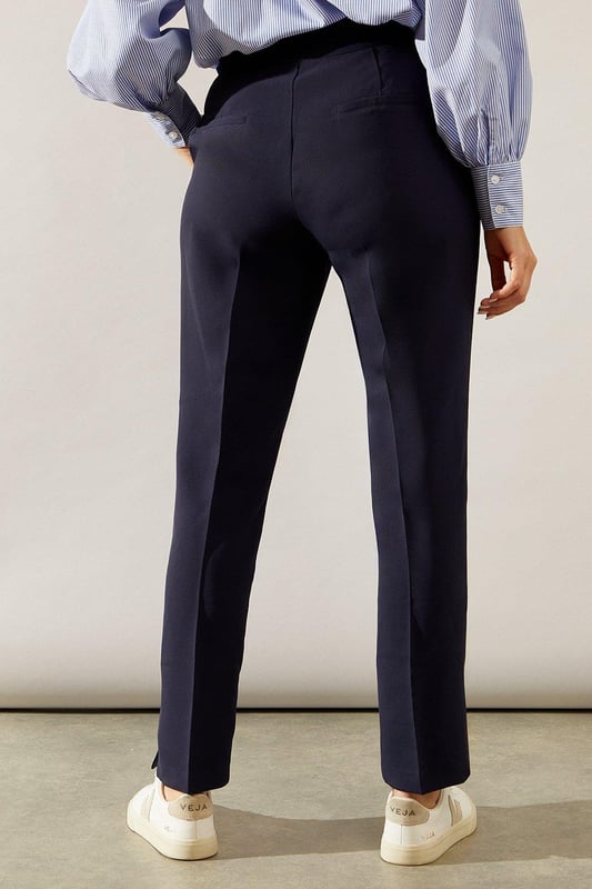 Tapered fit for a sleek silhouette
        Elegant split hem detail
        High-waisted design for a flattering fit
        Versatile style suitable for smart and casual occasions
        Comfortable stretch fabric for all-day wear
    
    These split hem tapered trousers from Wallis are the epitome of sophisticated style with a modern twist. The tapered fit creates a streamlined look that flatters your figure, while the split hem adds a touch of contemporary flair. Perfect for the woman who values both comfort and elegance, these trousers can effortlessly transition from day to night. Pair them with a crisp button-down shirt and blazer for a polished office ensemble, or dress them down with a silk blouse and statement jewellery for evening drinks. The high-waisted design not only accentuates your waistline but also provides a smooth foundation for tucked-in tops. Whether you're attending a formal event or aiming for a smart-casual look, these versatile trousers will ensure you always look put-together and feel confident.
