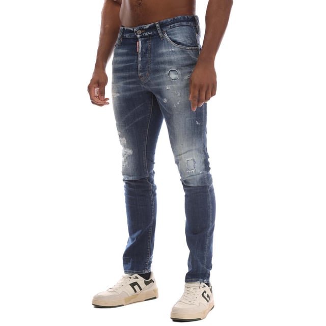 Mens DSquared2 Cool Guy Skinny-Fit Jeans in blue.- Button fastening.- Five pockets.- Belt loops.- Distressed.- Dsquared badge print on the back.- Skinny fit.- 99% Cotton  1% Elastane.- Ref: S74LB1585470
