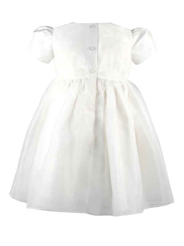 Perfect for Flower Girls, Bridesmaids or Special occasion!
'Dolly' evolved from one of our most popular dresses.

It has been beautifully re-designed to include our pin tuck detailed front, button back and gorgeous puffed sleeves to create the prettiest of dresses that is as comfortable as it is fun. Team it with a sash, ribbon or flower in any colour to match your colour scheme.

You'll find all our dresses are lined in cotton lawn for extra softness and perfect for sensitive skin.

The dress will arrive with you on a Satin padded hanger and covered in one of our Heritage garment protector bags for safe keeping.

Outer - 100% Mock Silk polyester fabric and trims

Lining - 100% cotton

Dry Clean or Hand Wash