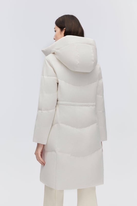 Crafted from smooth tech fabric, this lightweight coat offers windproof protection, stretchy inserts for freedom, and an adjustable drawstring waist.