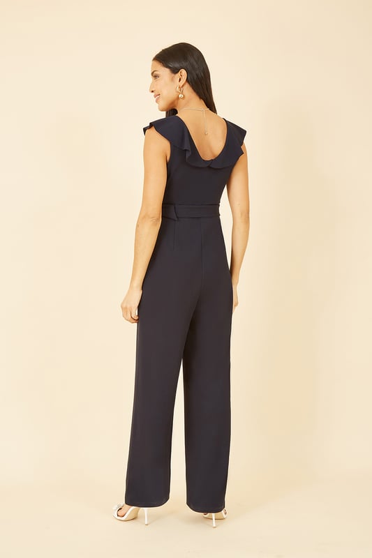 Mela Navy Jumpsuit With Gold Buckle and Frill Detail