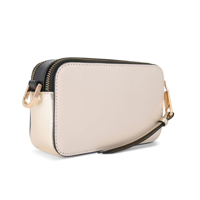 This Carvela Mini Roma Circle cross body bag features a bone exterior with round embossed branding on the front. There is branded gold hardware across the bag. Dimensions: 11cm (H), 18cm (L), 5cm (D). Strap length: 126cm.