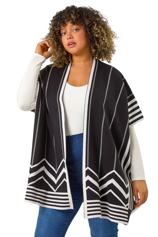 Curve Stripe Hem Square Poncho from Roman. Wrap up in style this Autumn with this our Curve stripe print poncho. Featuring an edge to edge opening and a beautiful border print detail, this versatile cardigan is perfect for adding a touch of sophistication to any outfit. Cut from a soft knit fabric finishing below hip length with trendy 3/4 sleeves, this square-shaped poncho is both cosy and stylish. Simply layer over a classic t-shirt and jeans for a casual yet put-together look!