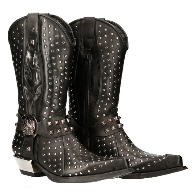 Estas botas, confeccionadas con piel de vaca de primera calidad, tienen la silueta clásica de un vaquero para ofrecer un estilo icónico y vanguardista. Con una caña alta y una punta puntiaguda, esta pieza mantiene las características que hicieron famosas a las botas de vaquero, pero también introduce giros creativos que elevan esta pieza. Se crea un aspecto audaz y contemporáneo mediante tachuelas en toda la parte superior y en la característica de tres correas que está decorada con un anillo de calavera de metal y está situada debajo de un diseño de llama plateada. Para mayor comodidad, New Rock ha introducido un forro de cuero suave en el interior y, para lograr un aspecto distintivo, ha elevado el tacón de metal, lo que da como resultado una apariencia audaz que redondea esta pieza. • Altura del tacón: 4 cm • Altura de la plataforma: 1 cm • Altura de la caña: 25 cm • Material exterior: piel de vaca