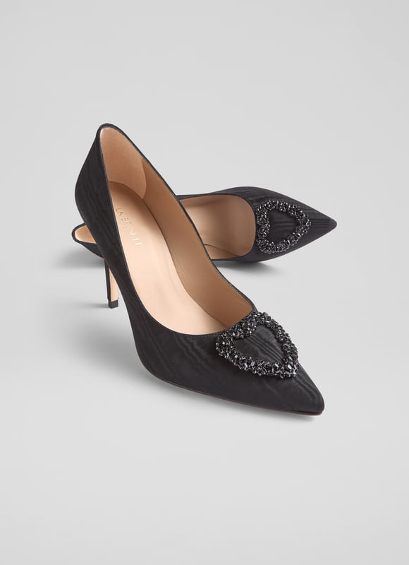 The Luella heart crystal court, in stunning black moirÃ© fabric, features a pointed toe and a sleek stiletto heel, all lined with luxurious leather. Pair these Spanish-made shoes with a stylish cocktail dress or enhance your favourite skinny jeans.