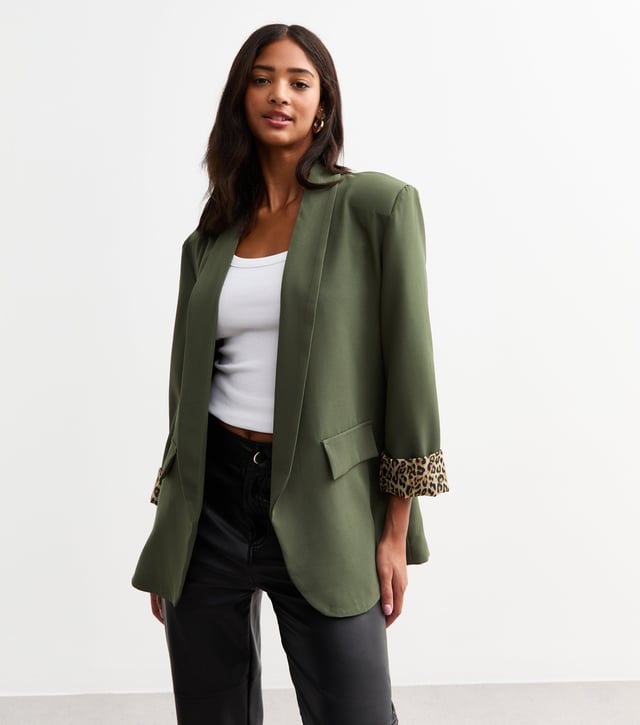 Elevate your style with our sleek Khaki Contrast Animal Edge to Edge Blazer. Stand out with its unique animal print contrast, perfect for the fashion-forward woman. This versatile blazer can be dressed up or down, making it a stylish addition to any wardrobe.