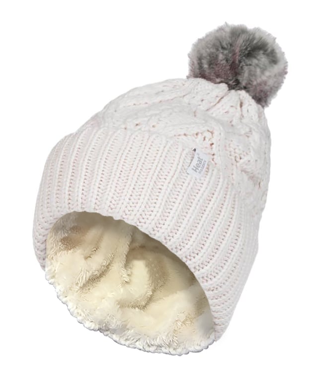 Like the original Heat Holders ladies pom pom but with a modern styled knit, this Solna styled hat like the original aims to keep you cosy and warm whilst keeping you fashionable with their contemporary style and knit. These womens pom pom hats have a fleece plush insulation lining, called Heatweaver, that is even more effective at holding warm air than any regular lining. This thermal lining is designed to be soft with a luxurious fleece feel (it almost feels like your touching the golden fleece) whilst holding warm air close to your skin, effectively keeping the cold air out. All of this is designed to ensure that you are toasty warm throughout the cold weather. This pom pom hat has a turn over cuff and a large faux fur fluffy pom pom on the top of the hat. This hat has a cable knit construction on its outer to give a fashionable touch. These ladies Solna hats are also to be considered the most slouch like out of all of Heat Holders’ range of thermal hats. These ladies Heat Holders Solna styled pom pom hats are available in 7 colours including cream, denim and light grey. They are made from 55% Polyester, 45% Acrylic on the outside of the hat and the lining is made from 100% Polyester. They come in one size and they are machine washable.
