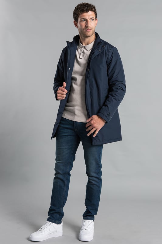Upgrade your outerwear with Kensington Eastside's mid-length coat. Featuring a funnel neck, zip and button fastening, and a PVC-coated outer, this jacket combines style and durability for any weather.