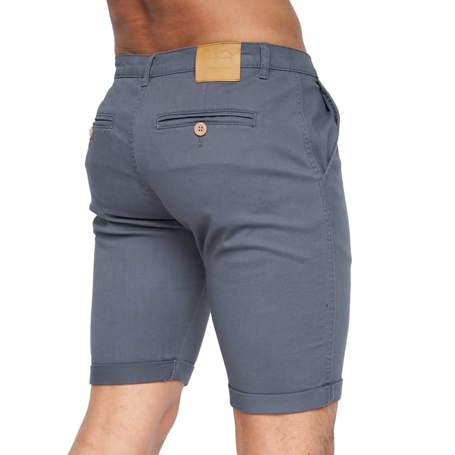 98% Polyester, 2% Elastane. Fabric: Canvas, Stretch. Design: Logo. Pockets: 2 Side Pockets, 2 Back Pockets, Jet Pocket, Buttoned. Fastening: Button, Zip Fly. Style: Chinos. Back Yoke, Belt Loops, Darted, Gripping Inner Waistband, Mock Horn Buttons, Self Fabric, Twin Needle Stitch.