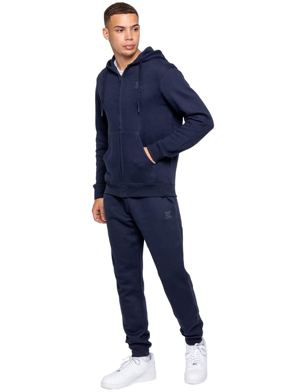 <div>Experimenta el máximo confort y estilo con los Joggers para Hombre de Ajuste Regular de Kruze, diseñados para mantenerte cómodo y con un aspecto impecable. Fabricados con forro polar cepillado en el interior, estos joggers ofrecen una suavidad y calidez excepcionales, lo que los convierte en una opción ideal para relajarte o salidas informales. Con una cintura acanalada y cordones ajustables, brindan un ajuste seguro y personalizado, mientras que los puños acanalados añaden un toque moderno y ajustado que se acomoda perfectamente sobre tus zapatillas. Los joggers incluyen dos prácticos bolsillos laterales, ideales para guardar tus esenciales, y un logotipo de Kruze estampado en goma en la pierna izquierda que aporta un toque de estilo característico.</div><div><br></div>