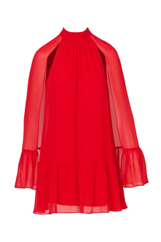 Dramatic details bring this classic shift dress to life. This cocktail dress features a shift silhouette, mock neckline, and a flounce hem. Crafted from chiffon fabric and fully lined, this party dress has a stunning attached cape. Boasting no waist seam and limited stretch, this trapeze dress is a comfortable look. A hidden zipper closure at the centre back completes this party dress. Style this cape dress for daytime events with neutral accessories or metallic access.