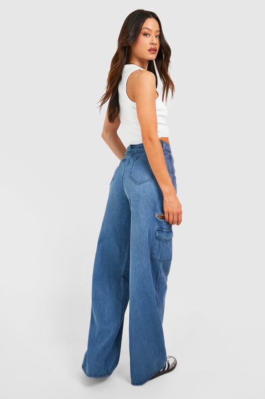Tall Blue Washed Side Rip Wide Leg Jeans New season update has dropped: and it's tall jeans. Tailored to tall girls, a staple pair of jeans is essential, whether for a casual shopping outing or to dress up with a nice top and heels for a night out. Designed to fit 5'7 and over, these long leg jeans are made for casual everyday wear and are the lowkey clothing piece to make your outfit look fire. These jeans are longer line with more fabric in the leg and torso, fitting perfectly to your figure.Style: Wide Leg JeansDesign: WashedFabric: CottonLength: RegularModel's height: 178cm / 5'10"