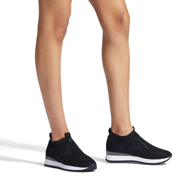 The Carvela Janeiro2 trainer features a black knitted upper in a low top sock-style. There is a black crystal embellishment across the toe with Icon C metal stud.
