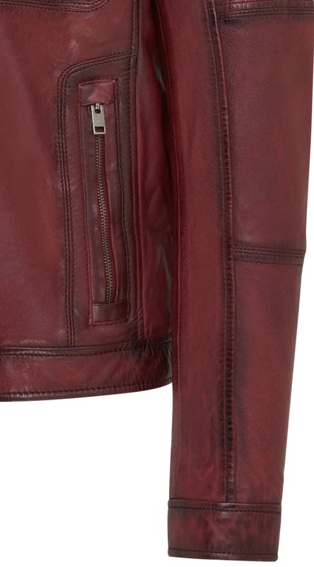 This Harrington biker jacket is a timeless classic, crafted from premium lamb leather with a vintage rub-off finish for a distinctive, worn-in look. Designed with functionality and style in mind, it features four outer zipped pockets and two internal pockets for practicality, along with a soft cotton lining for added comfort. The jacket’s sleek design, durable construction, and retro vibe make it an ideal choice for both casual outings and biker enthusiasts.

Premium lamb leather with a unique vintage rub-off finish.
Soft cotton lining for maximum comfort.
Four outer zipped pockets and two internal pockets for ample storage.
Classic Harrington collar for timeless style.
Durable front zip closure for easy wear.
Perfect for casual wear or adding a retro touch to your wardrobe.