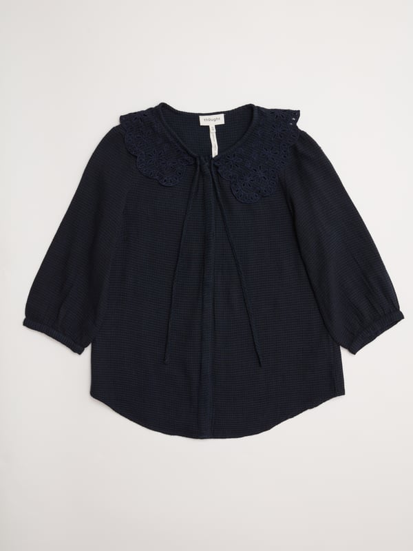 Discover the classic elegance of the Gale Collar Blouse, perfect for elevating your everyday style. Crafted from a soft cotton blend, featuring a textured weave and exquisite embroidered collar, this navy blouse is ideal for day-to-evening wear.